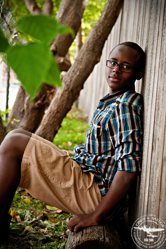 senior portrait of a boy in downtown mckinney on the square