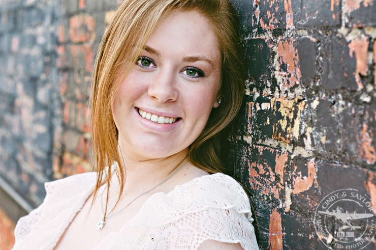 urban high school senior girl in downtown mckinney texas on the square