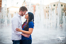 couple in front of fountain downtown ft worth engagement session in sundance square