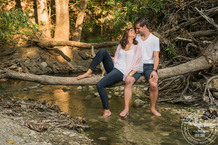 couple in creek engagement session in plano texas photos by Cindy & Saylor