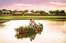 Texas sunset engagement session with canoe filled with flowers arranged by coco fleur